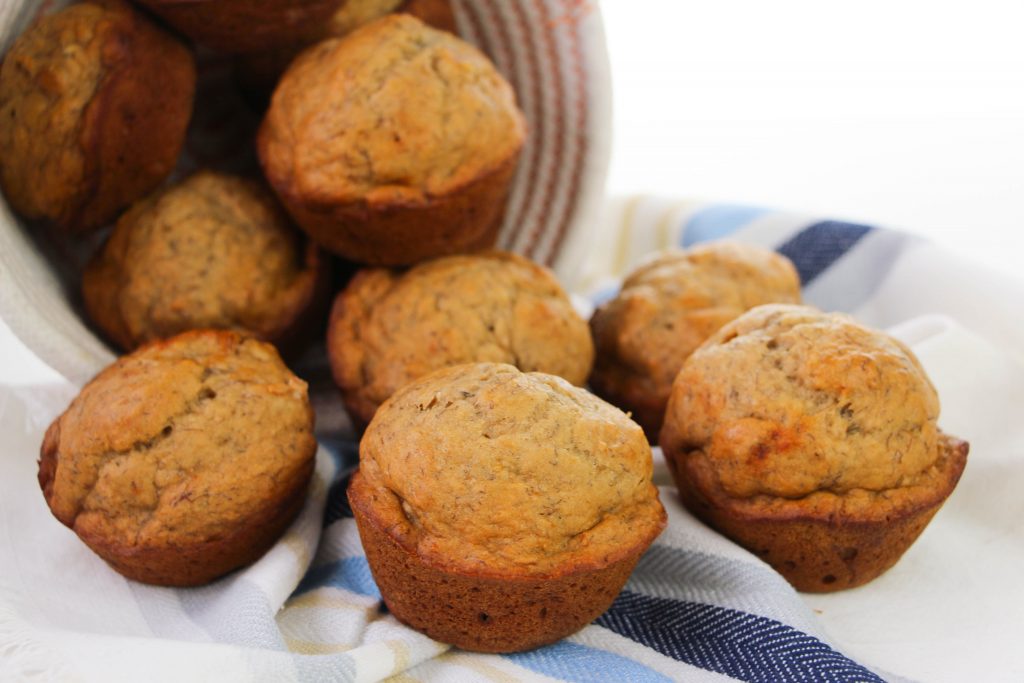 baked healthy banana muffins in a basket