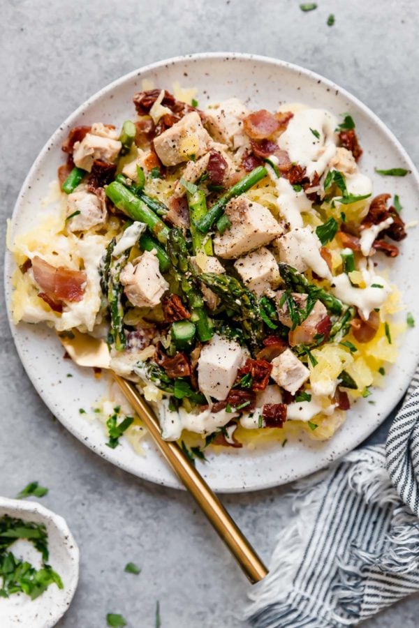 creamy chicken spaghetti squash with bacon and asparagus from The Real Food Dietitians!